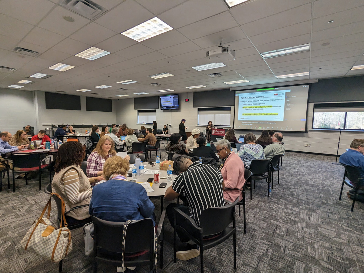 Faculty sitting together at a round table